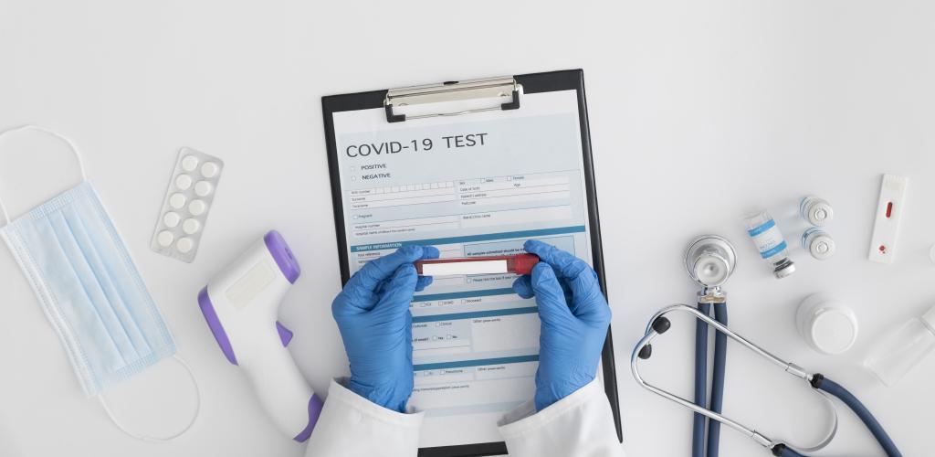 top-view-doctor-checking-covid-test
